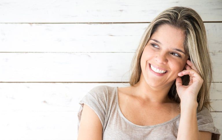 close-up of a pretty womans face smiling